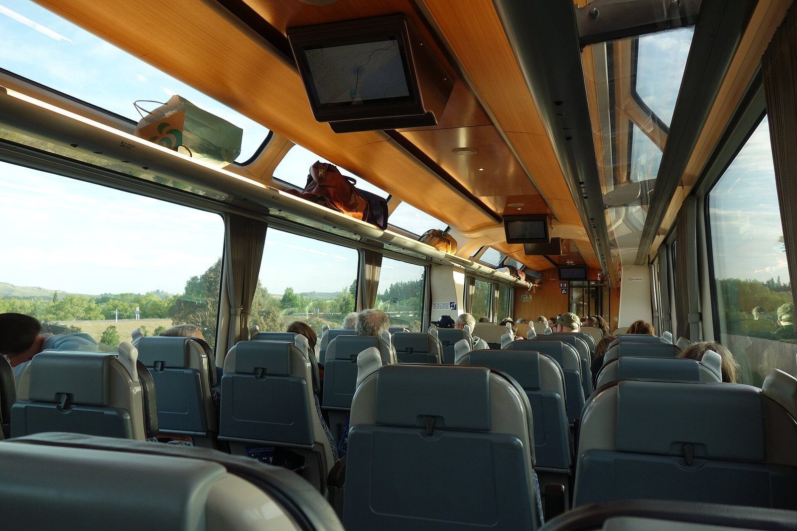 The interior of a Coastal Pacific carriage, seats and large windows