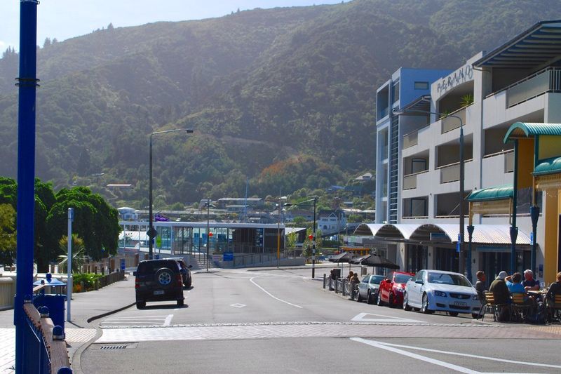 London Quay, Picton's waterfront street with outdoor cafe tables close to the ferry terminal
