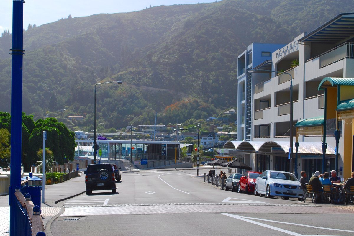 London Quay, Picton's waterfront street with outdoor cafe tables close to the ferry terminal