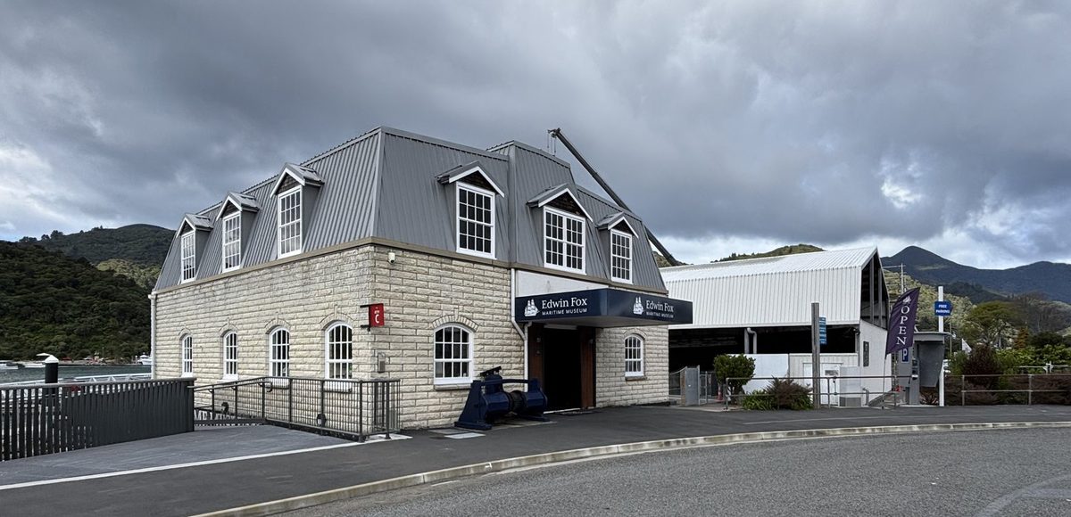 Wide view of the museum entrance, exhibition building and adjoining dry-dock shelter.
