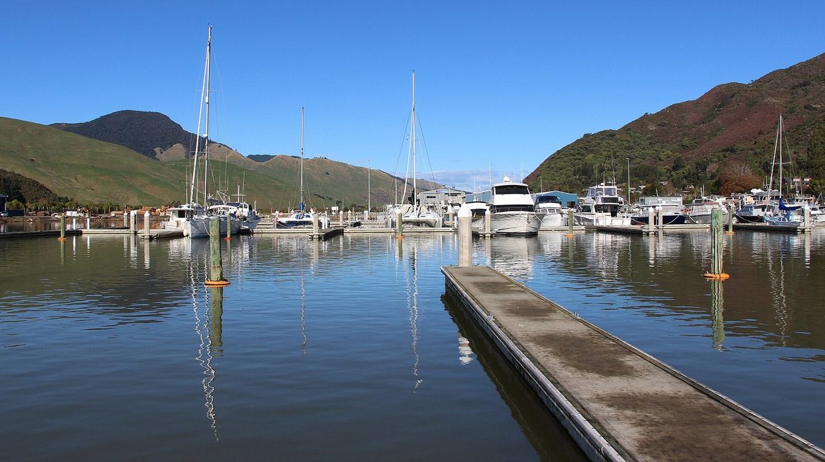 Havelock Marina with boats, pontoons and the surrounding hills at the head of Pelorus Sound / Te Hoiere.