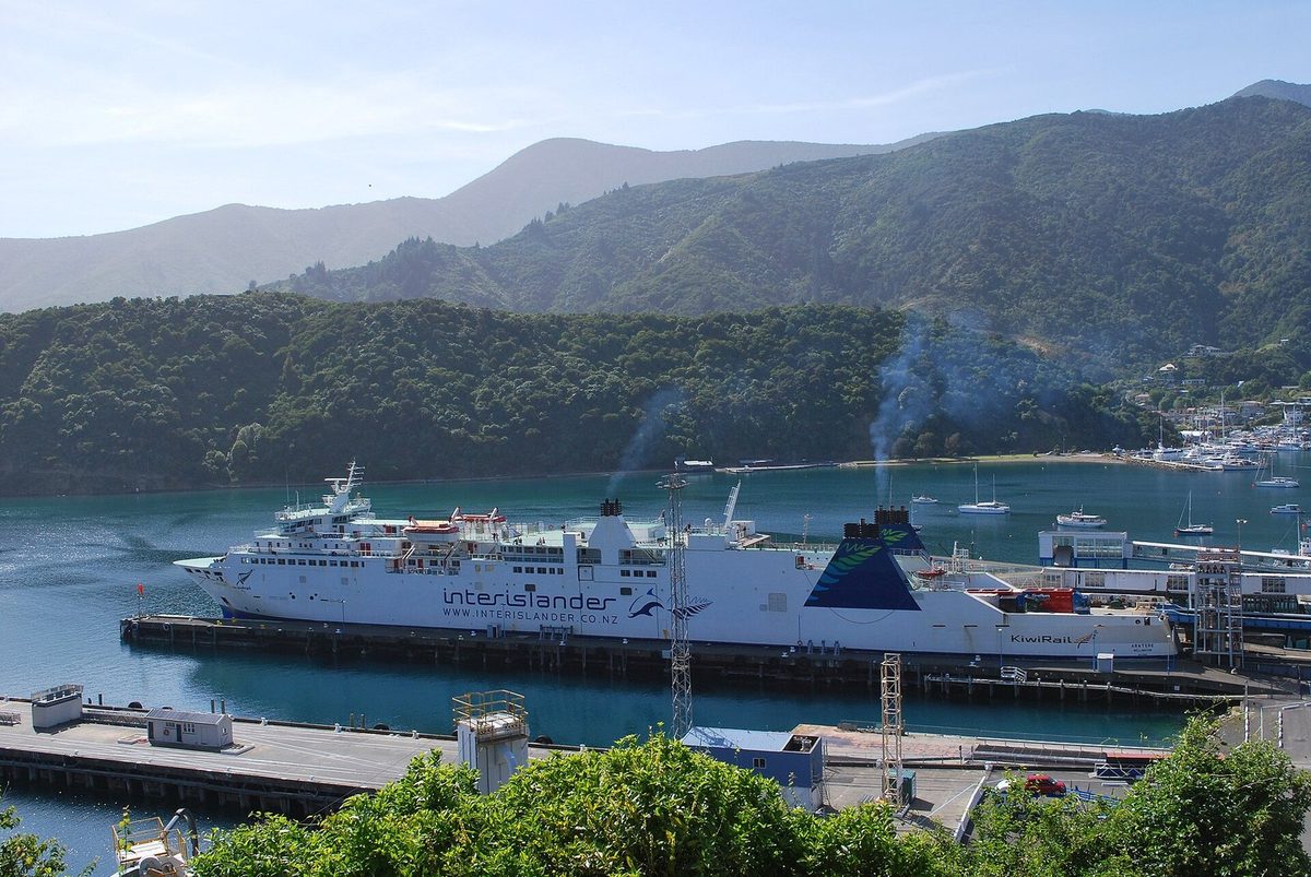 Kaipūpū's forested southern slope behind the Interislander ferry Aratere at Picton's terminal.