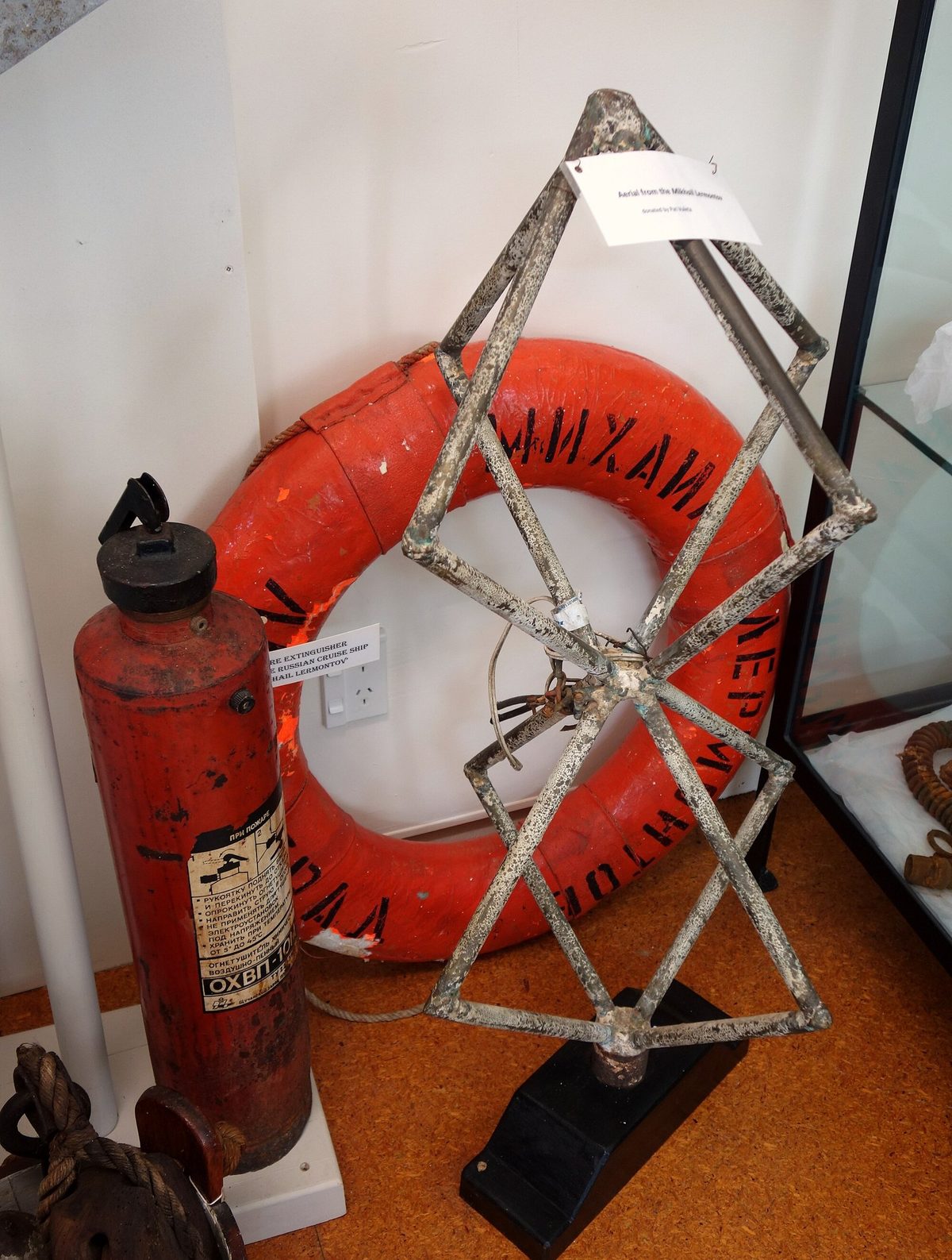 A lifebuoy, fire extinguisher and metal fitting recovered from the wreck of the Mikhail Lermontov.