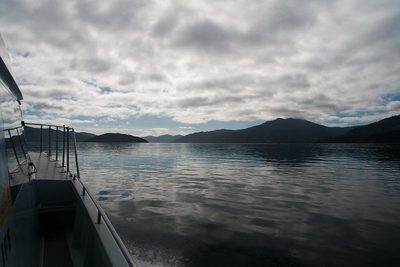 View from the side of the boat Delphinus while cruising on calm Queen Charlotte Sound.