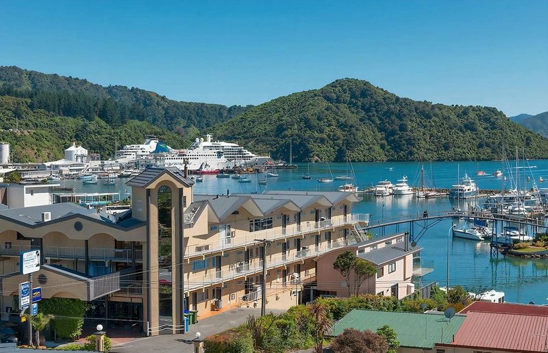 Elevated exterior view of the Picton Beachcomber Inn beside Picton marina and harbour.