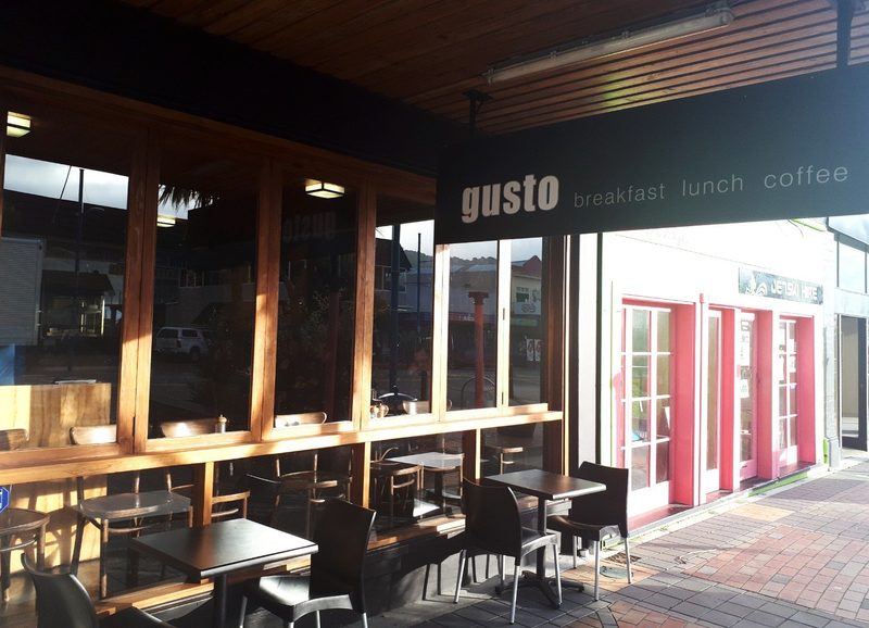 Gusto's High Street frontage, outdoor tables and branded breakfast-lunch-coffee sign.