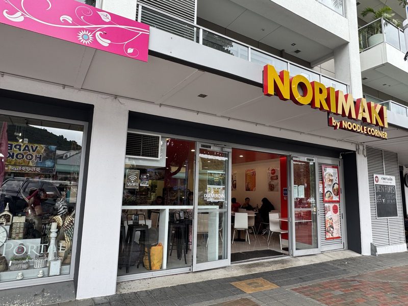 Norimaki by Noodle Corner shopfront on London Quay, with the signed entrance and part of the dining area visible.