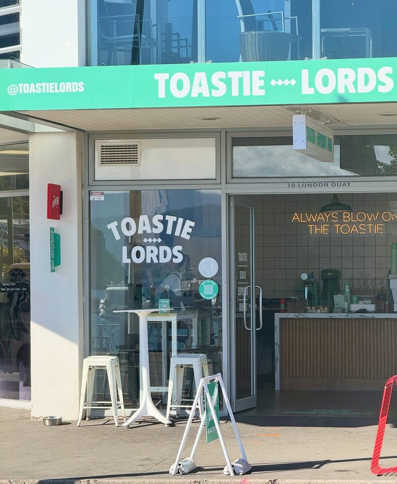 Toastie Lords storefront at 10 London Quay, with its green fascia, service counter and entrance visible.