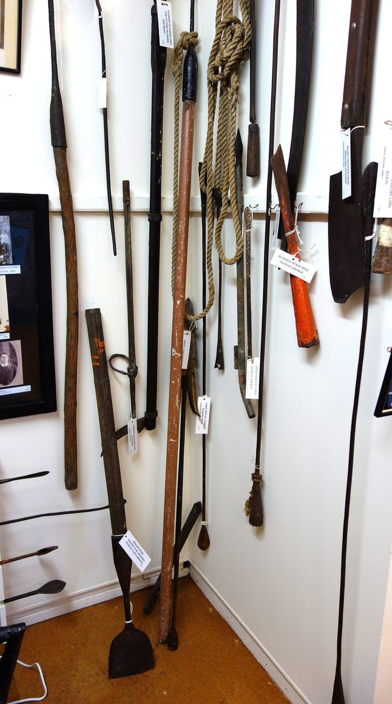A display of historic whaling tools and harpoons